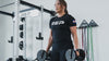 Woman exercising using Premium QuickDraw dumbbells with adjustable weight, fast switch adjustable  weight range technology and secure Lock-N-Load switches for high-performance strength training from Rep Fitness UK | Shop Premium Gym Equipment for Home & Commercial Use, Best Online Gym Equipment